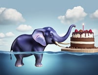 blue_elephant_eating_cake_at_cookie_factory_in_the_middle_of_the_ocean